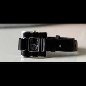 Roberto Cavalli watch, genuine leather band accessible on both sides of wrist.